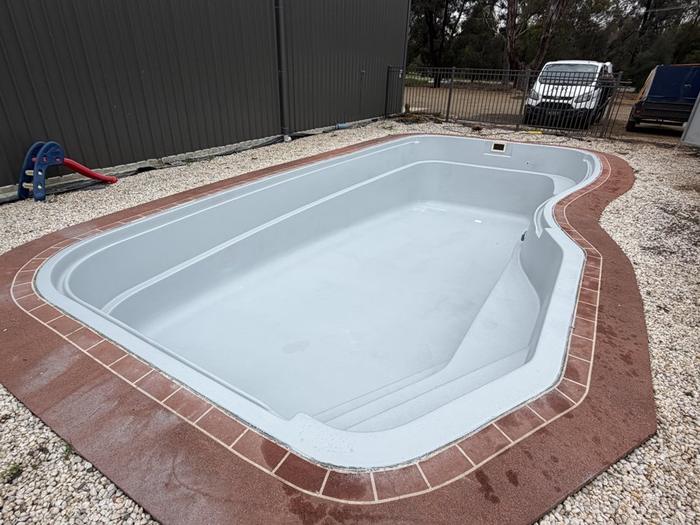 Freeform pool after resurfacing in grey, before filling