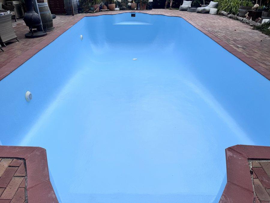Fibreglass pool finished in light blue with new returns and fittings