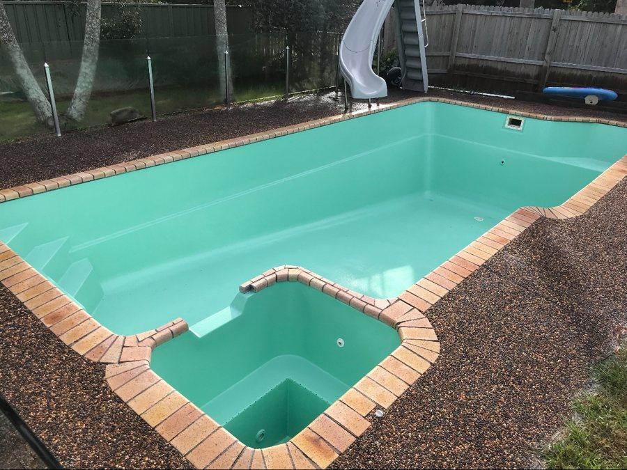 Pool and attached spa resurfaced in aqua