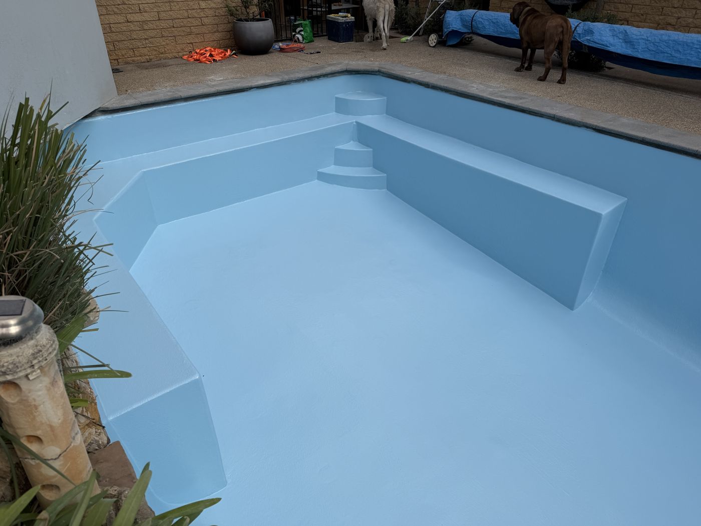 Custom-built steps and ledge, freshly finished in light blue gelcoat before filling